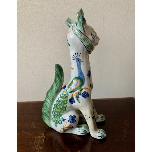 254 - Faience, Mosanic seated horned French ceramic cat, white with green and blue patterns including peac... 