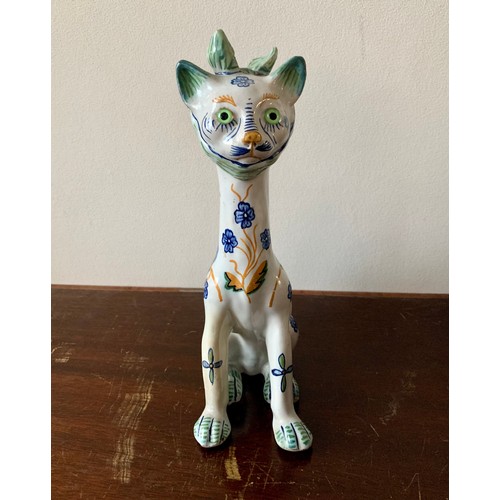 254 - Faience, Mosanic seated horned French ceramic cat, white with green and blue patterns including peac... 