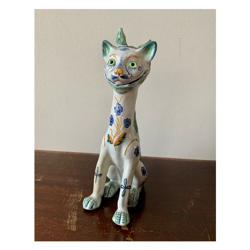 254 - Faience, Mosanic seated horned French ceramic cat, white with green and blue patterns including peac... 