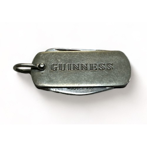 206 - Guinness, vintage Guinness pen knife / bottle opener with fold out twin tool action and hoop to be a... 