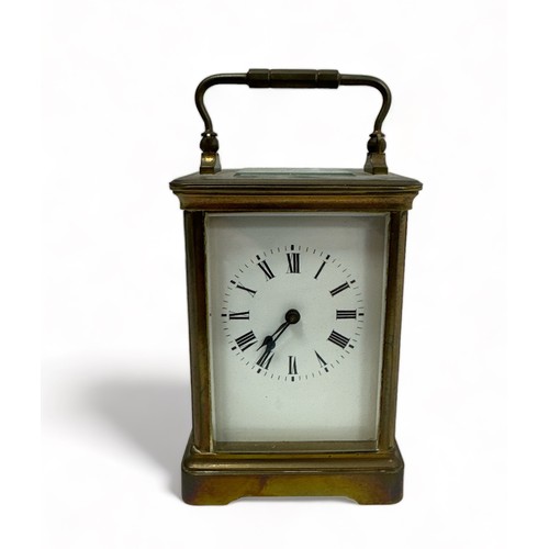 200 - Victorian brass carriage clock, four bevelled glass panels, unnamed face with Roman numerals. Back p... 