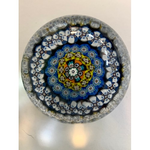 283 - Four vintage glass paperweights to include; Strathearn, millefiori designs. Diameters from 7cm to 8c... 