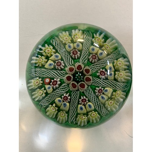 283 - Four vintage glass paperweights to include; Strathearn, millefiori designs. Diameters from 7cm to 8c... 