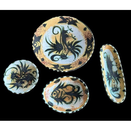 292 - Celtic Pottery Newlyn Cornwall. One plate decorated in the Pheonix pattern 95m. One oval shaped dish... 