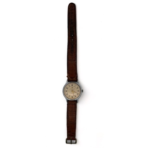 75 - An Ingersoll Ltd London Triumph Wristwatch on a brown leather strap. Gold coloured dial and hands, w... 