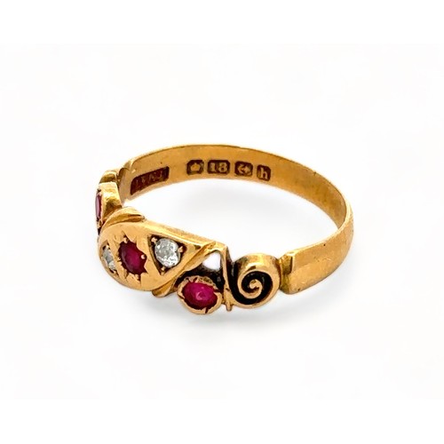 33 - An 18ct gold ruby and diamond gypsy ring with scroll shoulders. Size P. Birmingham 1907 hallmarks. 3... 