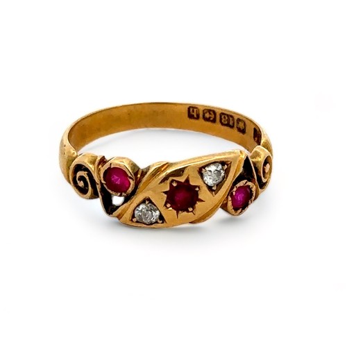 33 - An 18ct gold ruby and diamond gypsy ring with scroll shoulders. Size P. Birmingham 1907 hallmarks. 3... 