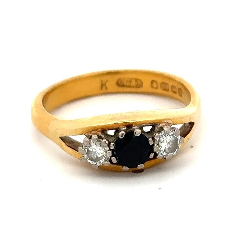 35 - A 22ct gold, sapphire and diamond ring, size R. Central sapphire of approx 4.2mm diameter is flanked... 