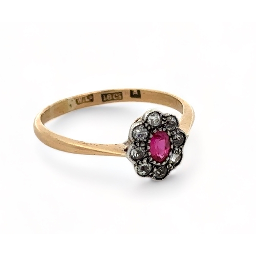 46 - A ruby and diamond cluster ring, set in 18ct yellow gold. Size O.  Weight 2.03g.