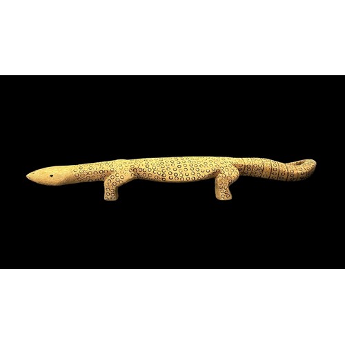 322 - Three Aboriginal Carved Lizards possibly representing Goanna's, monitor lizards, one 87 x 15cm cover... 