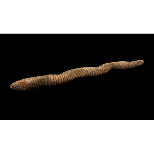 323 - Four Aboriginal Carved Wooden Snakes: The first 92cm in length decorated with poker work dashes and ... 