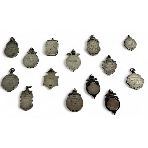 29 - A collection of silver watch fob pendants / medals etc. Mostly dating from 1920s/ 1930s.  Qty 14.