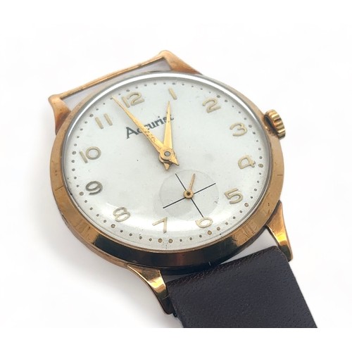 102 - A 1950s Accurist 9ct gold gents manual wristwatch.  Off-white dial with gold Arabic numerals and sub... 