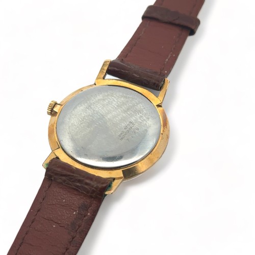 103 - A 1950s Precimax 17 jewels gents manual wristwatch. Gold plated case with Arabic/ baton hour markers... 