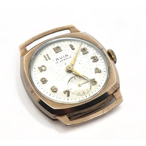 104 - A 9ct gold Avia cushion case gents manual wristwatch. Silvered dial with Arabic numerals, sub second... 