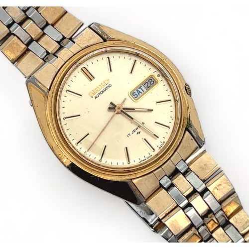 109 - A 1970s Seiko 1 jewel automatic gold plated watch with gold toned dial, baton hour markers and day/ ... 