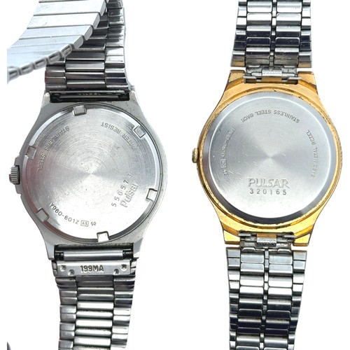 110 - Two quartz Pulsar Watches - A 1980s Pulsar Alarm with white dial and stainless case, Model No. Y960-... 