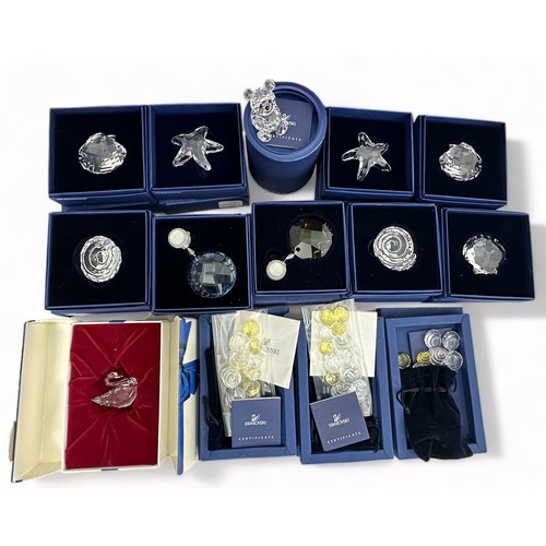 279 - Collection of swarovski crystal animals. Includes 2 x starfish (7400 NR 200 502), 2 x spiral shell (... 