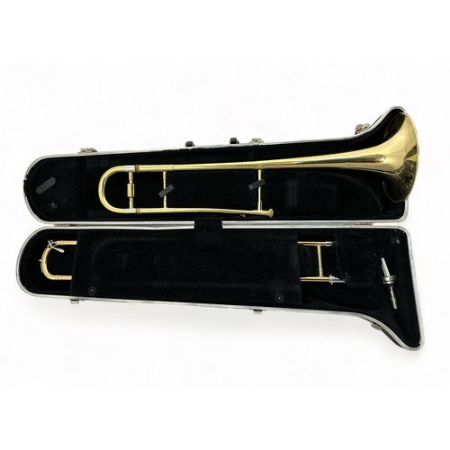 374 - A Blessing Scholastic USA Trombone in hardback fitted case. Generally in good condition with a few s... 