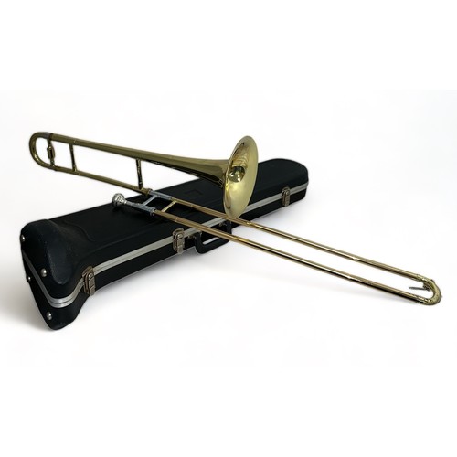 374 - A Blessing Scholastic USA Trombone in hardback fitted case. Generally in good condition with a few s... 