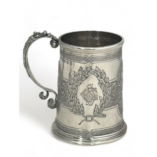 174 - A Victorian repousse silver tankard by H & S, Edinburgh, 1873. 9cm high. Inscribed on base 'Hamilton... 