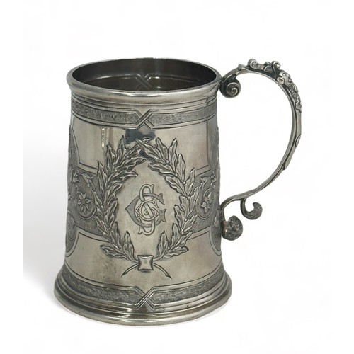 174 - A Victorian repousse silver tankard by H & S, Edinburgh, 1873. 9cm high. Inscribed on base 'Hamilton... 