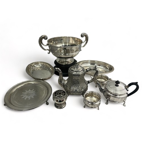 176 - A range of silver plate/ white metal items: punch bowl on wooden stand, ornate coffee pot, teapot et... 