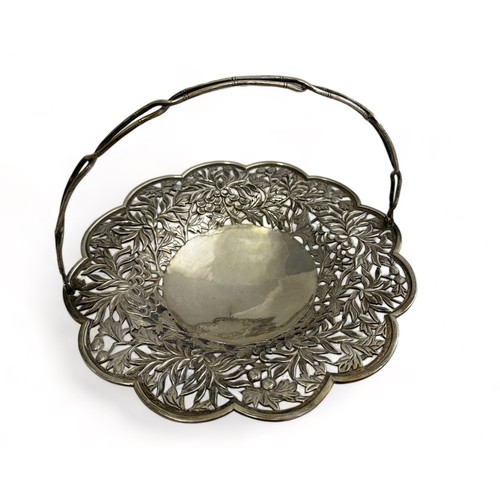 179 - A Chinese silver basket with floral pierced decoration. Diameter 22.2cm. 321g.