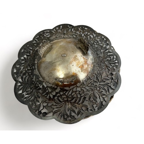 179 - A Chinese silver basket with floral pierced decoration. Diameter 22.2cm. 321g.