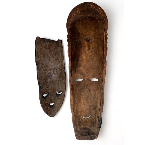 337 - Pair of decorative wooden tribal masks, two designs, one larger and hand painted. Heights 75cm & 48c... 