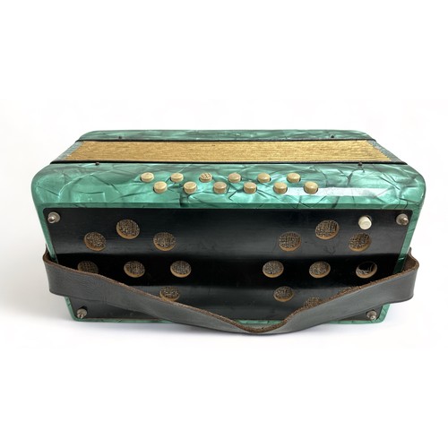 371 - A Hohner Mignon II Accordion. Turquoise. Appears to be playing.