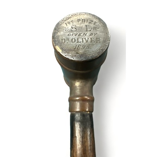 339 - Ebonised walking Stick with unusual brass barrel handle. Inscription on one end of barrel: 