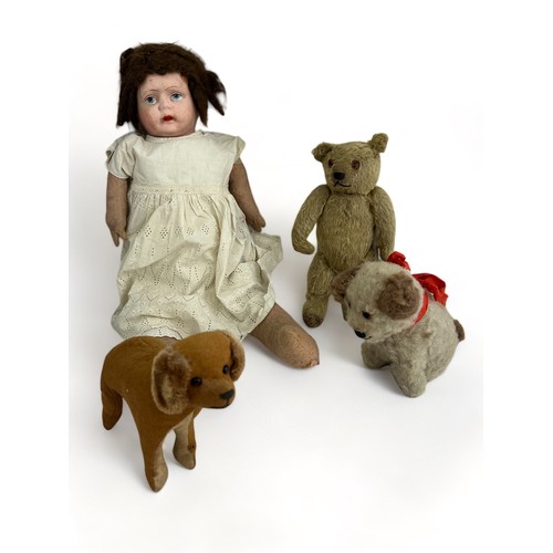 247 - A vintage doll, a vintage mohair teddy bear and two toy dogs. Makers unknown. Also some items of dol... 