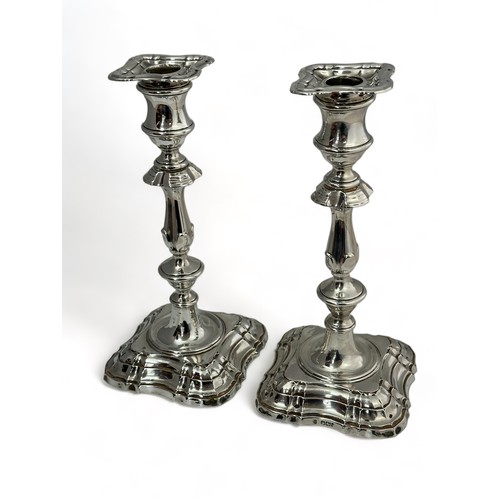 173 - A pair of mid 18th Century English style silver candlesticks with detachable sconces. By Fordham & F... 