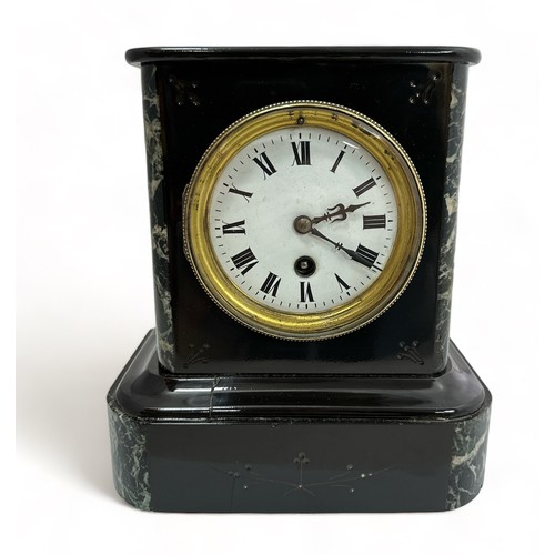 194 - Black slate and Marble Mantle Clock. Comes with pendulum and key. Has some minor damage to case whic... 