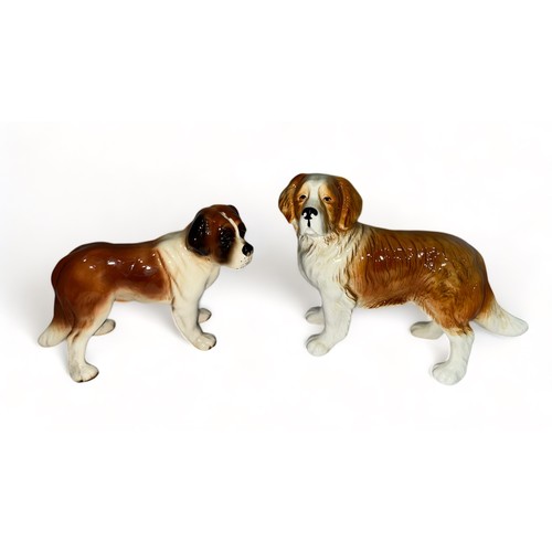 252 - St Bernard ceramic dog group, four ceramic St Bernard figurines of varying sizes, two marked ‘ Made ... 