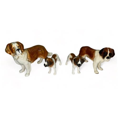 252 - St Bernard ceramic dog group, four ceramic St Bernard figurines of varying sizes, two marked ‘ Made ... 