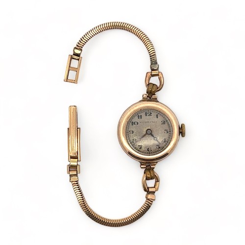 131 - Ladies Walker & Hall 9ct gold watch on plated strap. Sheffield hallmarks.