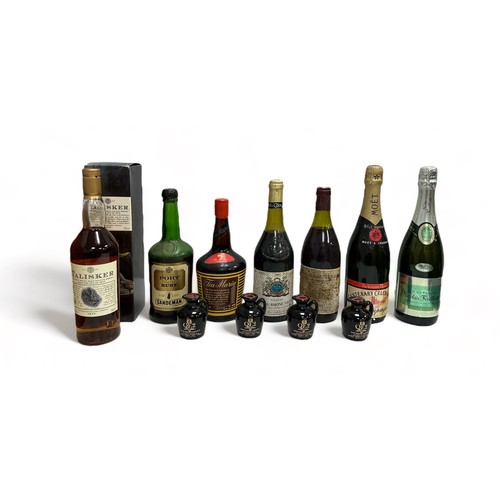 201 - A small group of vintage wines, champagnes and whiskeys including Talisker 'The only single malt sco... 