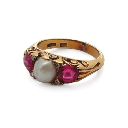 51 - A ruby and pearl ring in an 18ct gold scroll setting,  size I. Weight 5.4g.  Signs of resizing/ repa... 