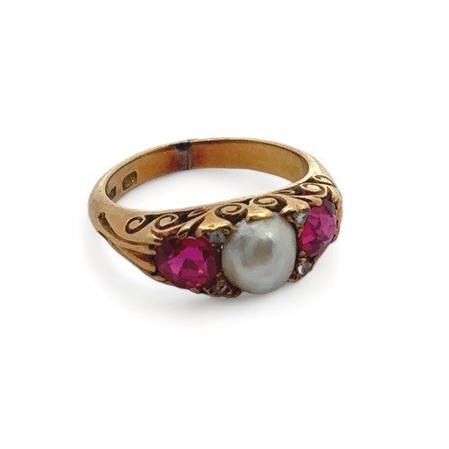 51 - A ruby and pearl ring in an 18ct gold scroll setting,  size I. Weight 5.4g.  Signs of resizing/ repa... 