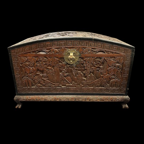 455 - A Chinese Carved Camphorwood Coffer. With curved lid. Made in Hong Kong. Provenance of being used on... 