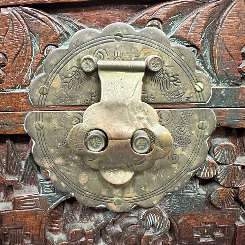 455 - A Chinese Carved Camphorwood Coffer. With curved lid. Made in Hong Kong. Provenance of being used on... 