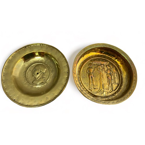 385 - Pair of Nuremberg brass alms bowls. The first with a punch decorated rim, the central panel decorate... 