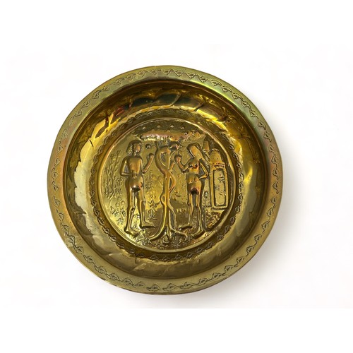 385 - Pair of Nuremberg brass alms bowls. The first with a punch decorated rim, the central panel decorate... 