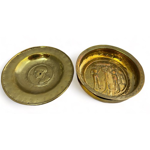 385 - Pair of Nuremberg brass alms bowls. The first with a punch decorated rim, the central panel decorate... 