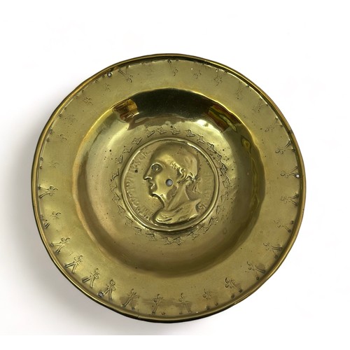 385 - Pair of Nuremberg brass alms bowls. The first with a punch decorated rim, the central panel decorate... 