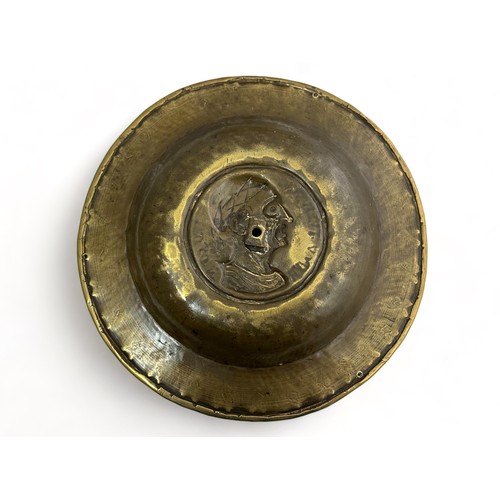 385 - Pair of Nuremberg brass alms bowls. The first with a punch decorated rim, the central panel decorate... 