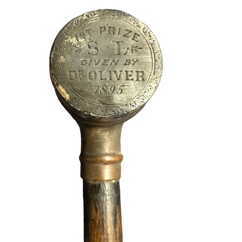 339 - Ebonised walking Stick with unusual brass barrel handle. Inscription on one end of barrel: 