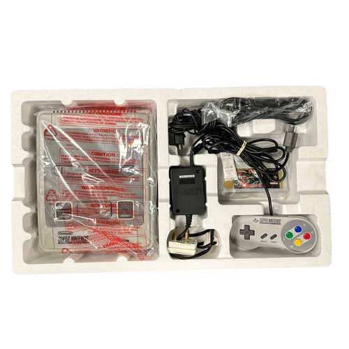 355A - A boxed PAL version of the Street Fighter 2 SNES Super Nintendo Console, complete with the iconic St... 